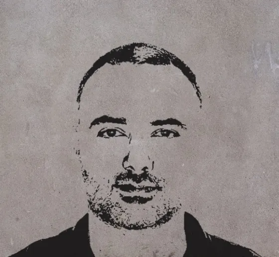 Toma Kashamov, in a stencil portrait on a concrete wall.